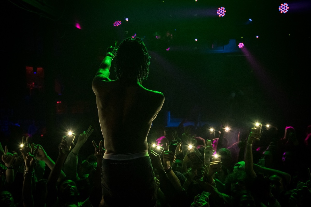 Smokepurpp in green lights with crowd